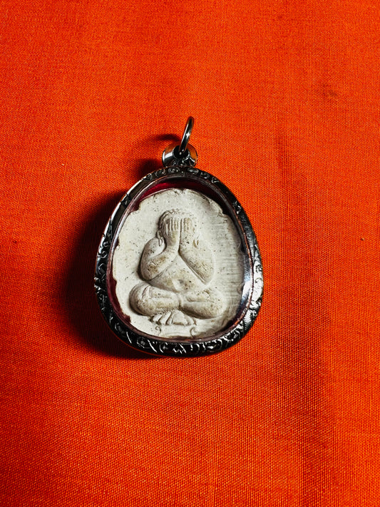 White Phra Pidta Sacred Amulet